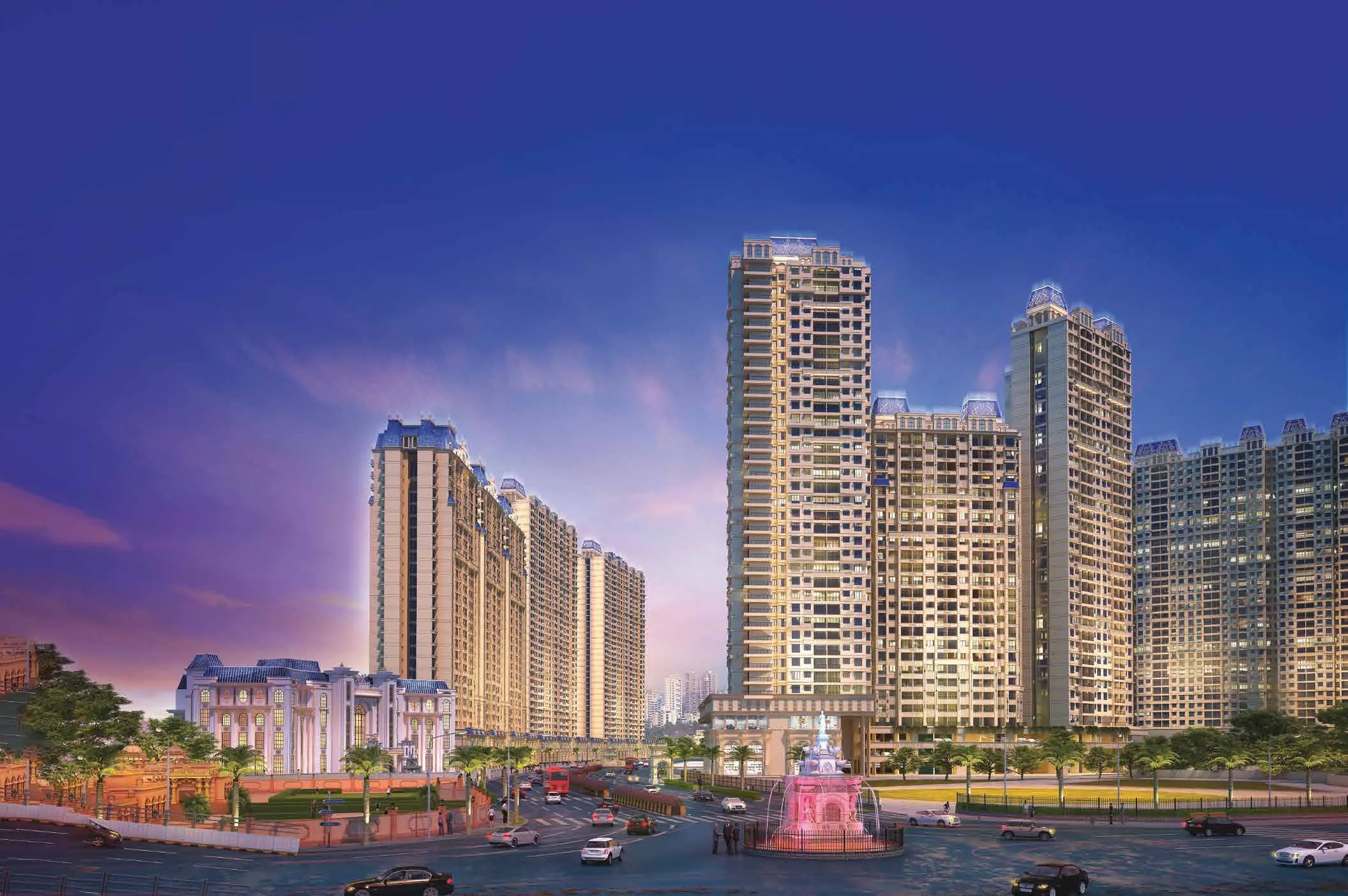 Artist’s impression of Swaminarayan City at dusk, with illuminated residential towers, a landscaped entrance and a fountain.